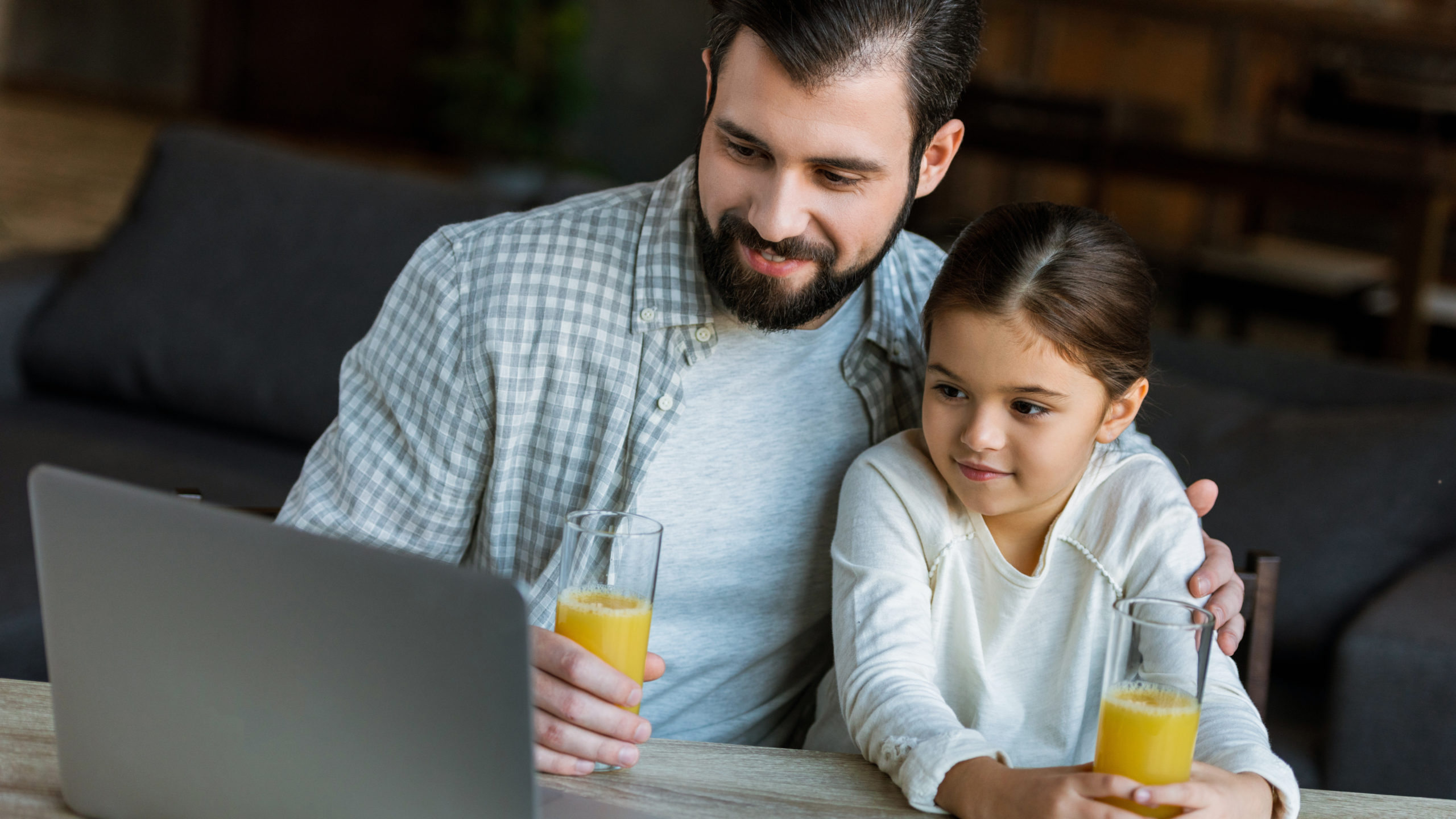 Dad with daughter on a video call